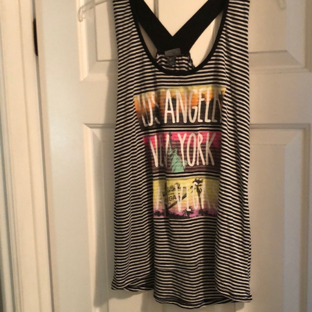 Black and white striped tank top with design.